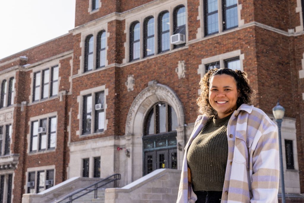 Student in front of Old Main